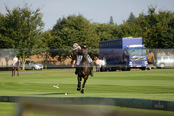 Pluma Negra (white) v Shoreline (black) in the Brecknock Cup Subsidiary final polo match played on Sunday 25 August 2013 at Cowdray Park Polo Club on Ambersham 1. 2013.10.12 www.polopictures.co.uk