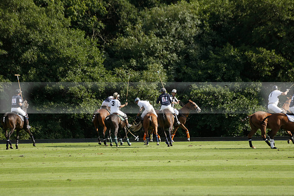 Pandas (white) v Home Farm (navy) in a Park House West Sussex Cup Polo match on Brooksfield at Cowdray Park Polo Club on Friday 30 August 2013. 2013.08.30 www.polopictures.co.uk