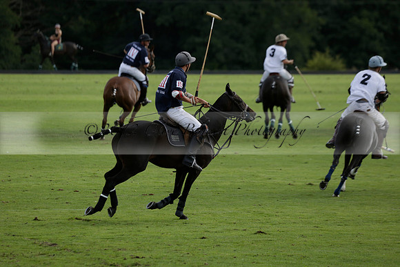 Pandas (white) v Home Farm (navy) in a Park House West Sussex Cup Polo match on Brooksfield at Cowdray Park Polo Club on Friday 30 August 2013. 2013.08.30 www.polopictures.co.uk