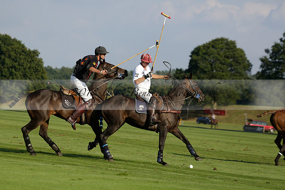 Pluma Negra (white) v Shoreline (black) in the Brecknock Cup Subsidiary final polo match played on Sunday 25 August 2013 at Cowdray Park Polo Club on Ambersham 1. 2013.10.12 www.polopictures.co.uk