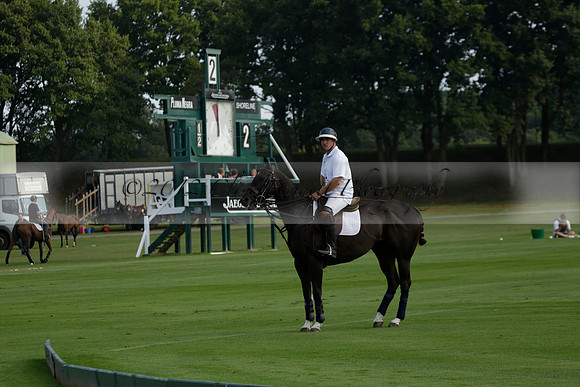 Pluma Negra (white) v Shoreline (black) in the Brecknock Cup Subsidiary final polo match played on Sunday 25 August 2013 at Cowdray Park Polo Club on Ambersham 1. 2013.10.12 www.polopictures.co.uk