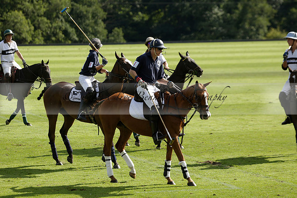 Pandas (white) v Home Farm (navy) in a Park House West Sussex Cup Polo match on Brooksfield at Cowdray Park Polo Club on Friday 30 August 2013. 2013.08.30 www.polopictures.co.uk