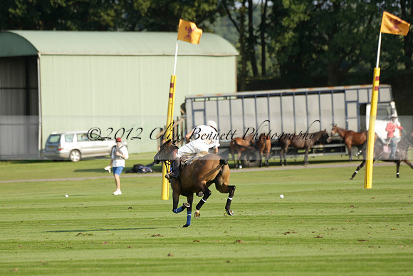 Pluma Negra (white) v Shoreline (black) in the Brecknock Cup Subsidiary final polo match played on Sunday 25 August 2013 at Cowdray Park Polo Club on Ambersham 1. 2013.10.12 www.polopictures.co.uk