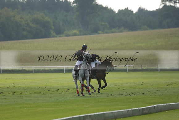 Pluma Negra (white) v Shoreline (black) in the Brecknock Cup Subsidiary final polo match played on Sunday 25 August 2013 at Cowdray Park Polo Club on Ambersham 1. 2013.10.12 www.polopictures.co.uk