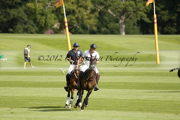 Pandas (white) v Home Farm (navy) in a Park House West Sussex Cup Polo match on Brooksfield at Cowdray Park Polo Club on Friday 30 August 2013. 2013.08.30 www.polopictures.co.uk