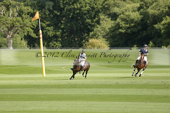 Pandas (white) v Home Farm (navy) in a Park House West Sussex Cup Polo match on Brooksfield at Cowdray Park Polo Club on Friday 30 August 2013. 2013.08.30 www.polopictures.co.uk