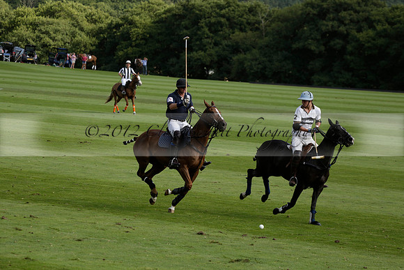 Pandas (white) v Home Farm (navy) in a Park House West Sussex Cup Polo match on Brooksfield at Cowdray Park Polo Club on Friday 30 August 2013. 2013.08.30 www.polopictures.co.uk