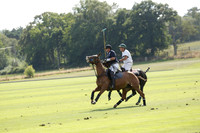 Pandas (white) v Home Farm (navy) in a Park House West Sussex Cup Polo match on Brooksfield at Cowdray Park Polo Club on Friday 30 August 2013. 2013.08.30 www.polopictures.co.uk
