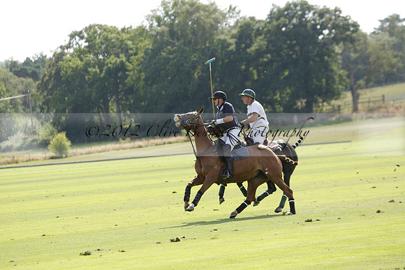 Pandas (white) v Home Farm (navy) in a Park House West Sussex Cup Polo match on Brooksfield at Cowdray Park Polo Club on Friday 30 August 2013. 2013.08.30 www.polopictures.co.uk