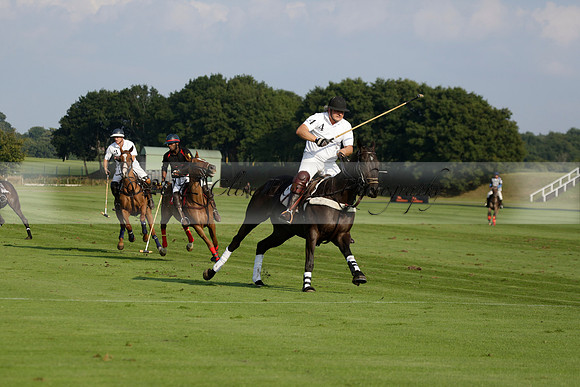 Pluma Negra (white) v Shoreline (black) in the Brecknock Cup Subsidiary final polo match played on Sunday 25 August 2013 at Cowdray Park Polo Club on Ambersham 1. 2013.10.12 www.polopictures.co.uk
