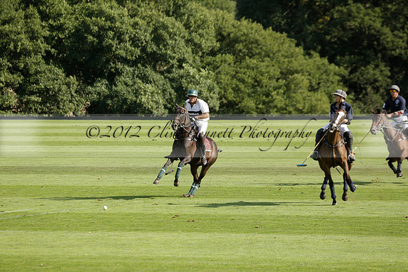 Pandas (white) v Home Farm (navy) in a Park House West Sussex Cup Polo match on Brooksfield at Cowdray Park Polo Club on Friday 30 August 2013. 2013.08.30 www.polopictures.co.uk