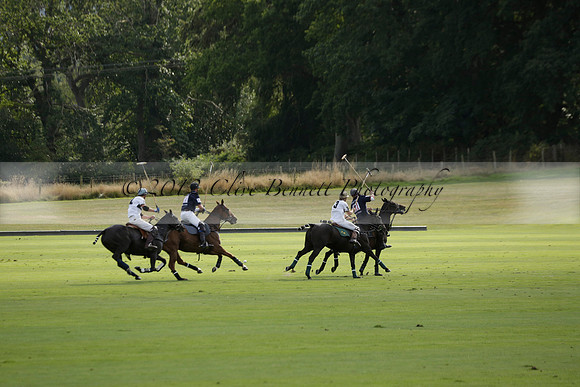Pandas (white) v Home Farm (navy) in a Park House West Sussex Cup Polo match on Brooksfield at Cowdray Park Polo Club on Friday 30 August 2013. 2013.08.30 www.polopictures.co.uk