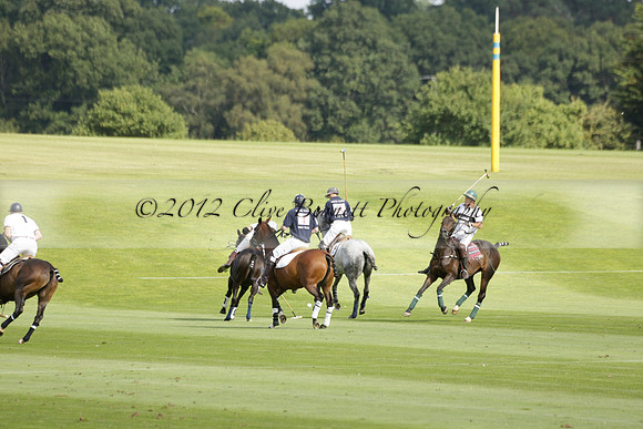 Pandas (white) v Home Farm (navy) in a Park House West Sussex Cup Polo match on Brooksfield at Cowdray Park Polo Club on Friday 30 August 2013. 2013.08.30 www.polopictures.co.uk