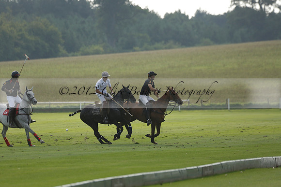 Pluma Negra (white) v Shoreline (black) in the Brecknock Cup Subsidiary final polo match played on Sunday 25 August 2013 at Cowdray Park Polo Club on Ambersham 1. 2013.10.12 www.polopictures.co.uk