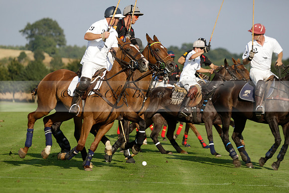 Pluma Negra (white) v Shoreline (black) in the Brecknock Cup Subsidiary final polo match played on Sunday 25 August 2013 at Cowdray Park Polo Club on Ambersham 1. 2013.10.12 www.polopictures.co.uk