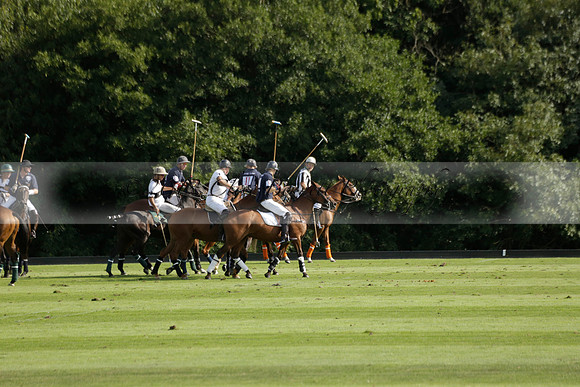 Pandas (white) v Home Farm (navy) in a Park House West Sussex Cup Polo match on Brooksfield at Cowdray Park Polo Club on Friday 30 August 2013. 2013.08.30 www.polopictures.co.uk