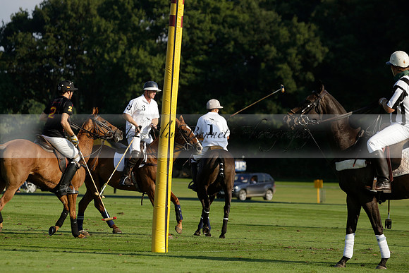 Pluma Negra (white) v Shoreline (black) in the Brecknock Cup Subsidiary final polo match played on Sunday 25 August 2013 at Cowdray Park Polo Club on Ambersham 1. 2013.10.12 www.polopictures.co.uk
