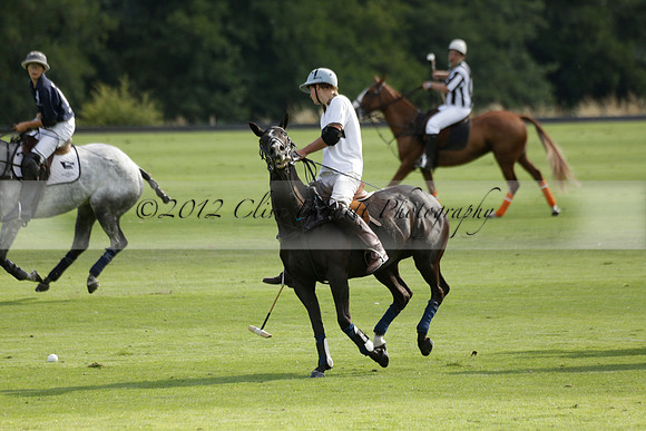 Pandas (white) v Home Farm (navy) in a Park House West Sussex Cup Polo match on Brooksfield at Cowdray Park Polo Club on Friday 30 August 2013. 2013.08.30 www.polopictures.co.uk
