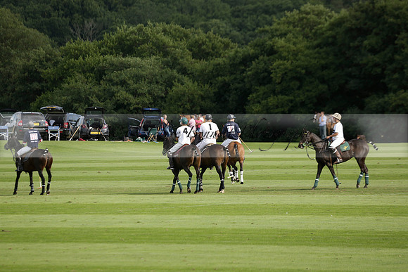 Pandas (white) v Home Farm (navy) in a Park House West Sussex Cup Polo match on Brooksfield at Cowdray Park Polo Club on Friday 30 August 2013. 2013.08.30 www.polopictures.co.uk