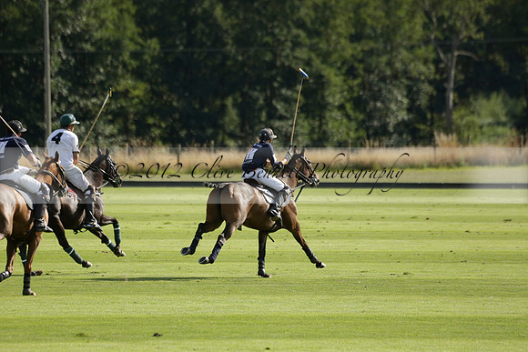Pandas (white) v Home Farm (navy) in a Park House West Sussex Cup Polo match on Brooksfield at Cowdray Park Polo Club on Friday 30 August 2013. 2013.08.30 www.polopictures.co.uk
