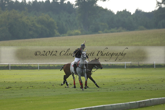 Pluma Negra (white) v Shoreline (black) in the Brecknock Cup Subsidiary final polo match played on Sunday 25 August 2013 at Cowdray Park Polo Club on Ambersham 1. 2013.10.12 www.polopictures.co.uk