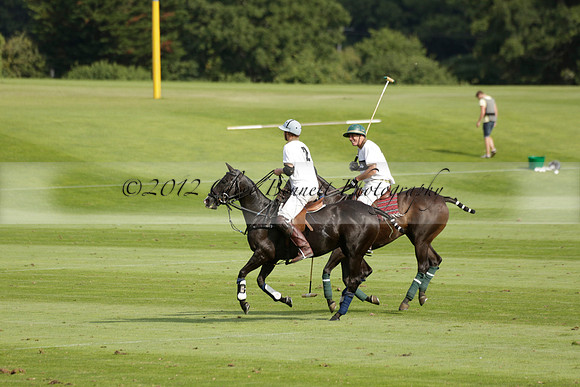 Pandas (white) v Home Farm (navy) in a Park House West Sussex Cup Polo match on Brooksfield at Cowdray Park Polo Club on Friday 30 August 2013. 2013.08.30 www.polopictures.co.uk