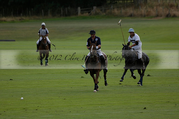 Pandas (white) v Home Farm (navy) in a Park House West Sussex Cup Polo match on Brooksfield at Cowdray Park Polo Club on Friday 30 August 2013. 2013.08.30 www.polopictures.co.uk
