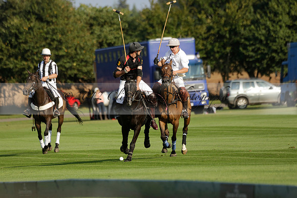Pluma Negra (white) v Shoreline (black) in the Brecknock Cup Subsidiary final polo match played on Sunday 25 August 2013 at Cowdray Park Polo Club on Ambersham 1. 2013.10.12 www.polopictures.co.uk