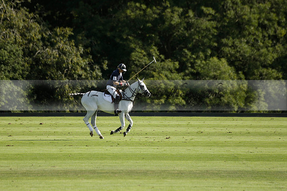 Pandas (white) v Home Farm (navy) in a Park House West Sussex Cup Polo match on Brooksfield at Cowdray Park Polo Club on Friday 30 August 2013. 2013.08.30 www.polopictures.co.uk
