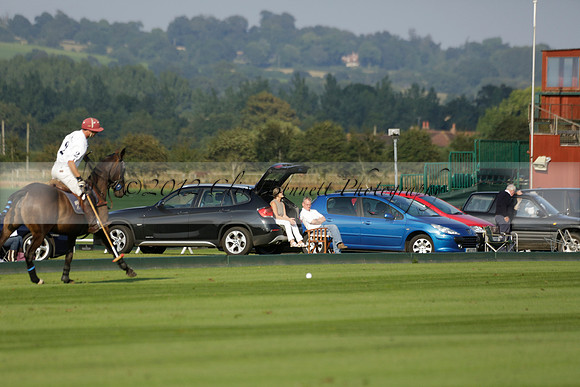 Pluma Negra (white) v Shoreline (black) in the Brecknock Cup Subsidiary final polo match played on Sunday 25 August 2013 at Cowdray Park Polo Club on Ambersham 1. 2013.10.12 www.polopictures.co.uk