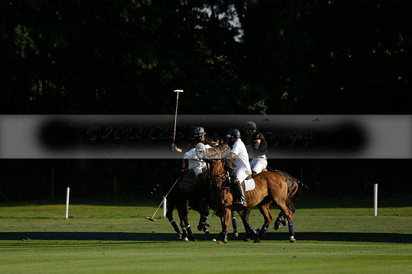 Pluma Negra (white) v Shoreline (black) in the Brecknock Cup Subsidiary final polo match played on Sunday 25 August 2013 at Cowdray Park Polo Club on Ambersham 1. 2013.10.12 www.polopictures.co.uk