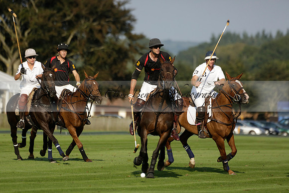 Pluma Negra (white) v Shoreline (black) in the Brecknock Cup Subsidiary final polo match played on Sunday 25 August 2013 at Cowdray Park Polo Club on Ambersham 1. 2013.10.12 www.polopictures.co.uk