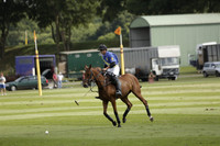 Combe Place (blue) v Silver Fox (white) in a Park House West Sussex Cup Polo match on Ambersham 1 at Cowdray Park Polo Club on Friday 30 August 2013. 2013.08.30 www.polopictures.co.uk