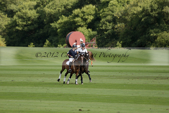 Pandas (white) v Home Farm (navy) in a Park House West Sussex Cup Polo match on Brooksfield at Cowdray Park Polo Club on Friday 30 August 2013. 2013.08.30 www.polopictures.co.uk