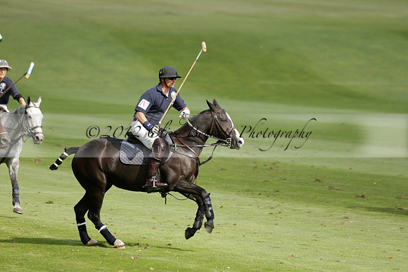 Pandas (white) v Home Farm (navy) in a Park House West Sussex Cup Polo match on Brooksfield at Cowdray Park Polo Club on Friday 30 August 2013. 2013.08.30 www.polopictures.co.uk