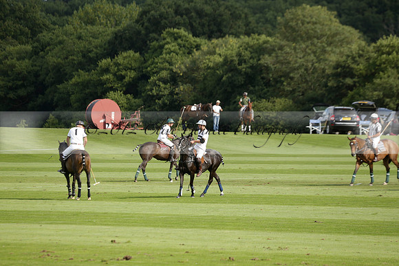 Pandas (white) v Home Farm (navy) in a Park House West Sussex Cup Polo match on Brooksfield at Cowdray Park Polo Club on Friday 30 August 2013. 2013.08.30 www.polopictures.co.uk