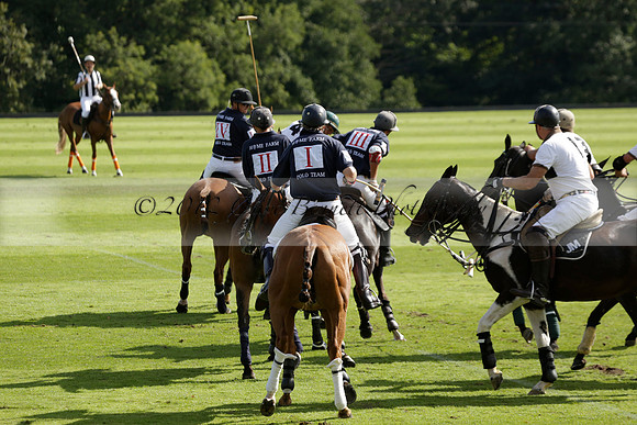 Pandas (white) v Home Farm (navy) in a Park House West Sussex Cup Polo match on Brooksfield at Cowdray Park Polo Club on Friday 30 August 2013. 2013.08.30 www.polopictures.co.uk