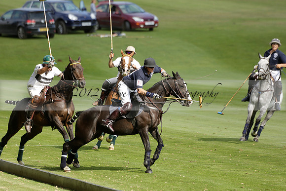 Pandas (white) v Home Farm (navy) in a Park House West Sussex Cup Polo match on Brooksfield at Cowdray Park Polo Club on Friday 30 August 2013. 2013.08.30 www.polopictures.co.uk
