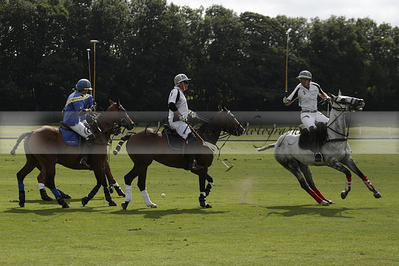 Combe Place (blue) v Silver Fox (white) in a Park House West Sussex Cup Polo match on Ambersham 1 at Cowdray Park Polo Club on Friday 30 August 2013. 2013.08.30 www.polopictures.co.uk