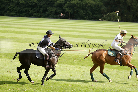 Pandas (white) v Home Farm (navy) in a Park House West Sussex Cup Polo match on Brooksfield at Cowdray Park Polo Club on Friday 30 August 2013. 2013.08.30 www.polopictures.co.uk