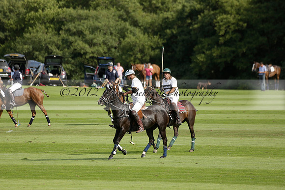 Pandas (white) v Home Farm (navy) in a Park House West Sussex Cup Polo match on Brooksfield at Cowdray Park Polo Club on Friday 30 August 2013. 2013.08.30 www.polopictures.co.uk