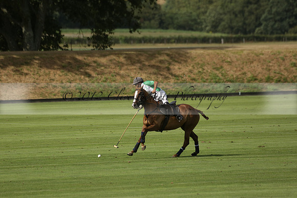 Jaeger Le Coultre (black)  v Wairakei Pastoral (white) in a Jaeger Le Coultre Holden White Cup polo match played on 29 July 2013 at Cowdray Park Polo Club on Brooksfieldwww.polopictures.co.uk