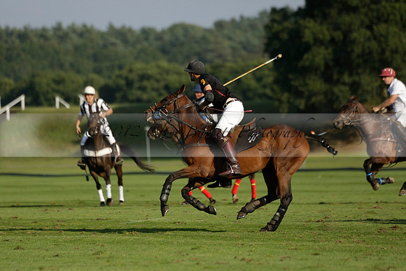 Pluma Negra (white) v Shoreline (black) in the Brecknock Cup Subsidiary final polo match played on Sunday 25 August 2013 at Cowdray Park Polo Club on Ambersham 1. 2013.10.12 www.polopictures.co.uk