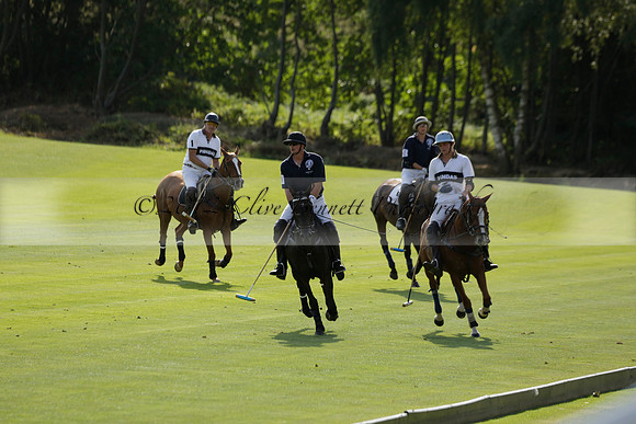 Pandas (white) v Home Farm (navy) in a Park House West Sussex Cup Polo match on Brooksfield at Cowdray Park Polo Club on Friday 30 August 2013. 2013.08.30 www.polopictures.co.uk
