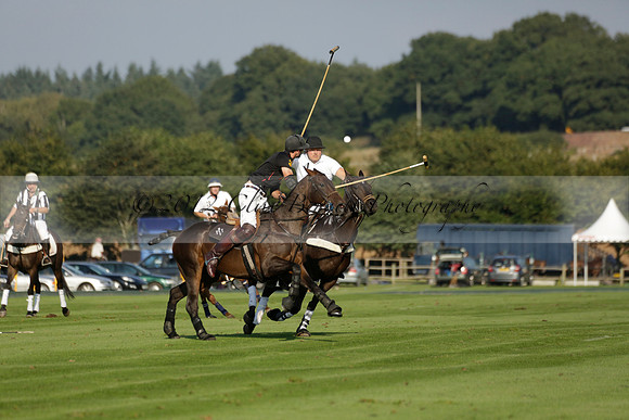 Pluma Negra (white) v Shoreline (black) in the Brecknock Cup Subsidiary final polo match played on Sunday 25 August 2013 at Cowdray Park Polo Club on Ambersham 1. 2013.10.12 www.polopictures.co.uk