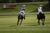 Combe Place (blue) v Silver Fox (white) in a Park House West Sussex Cup Polo match on Ambersham 1 at Cowdray Park Polo Club on Friday 30 August 2013. 2013.08.30 www.polopictures.co.uk