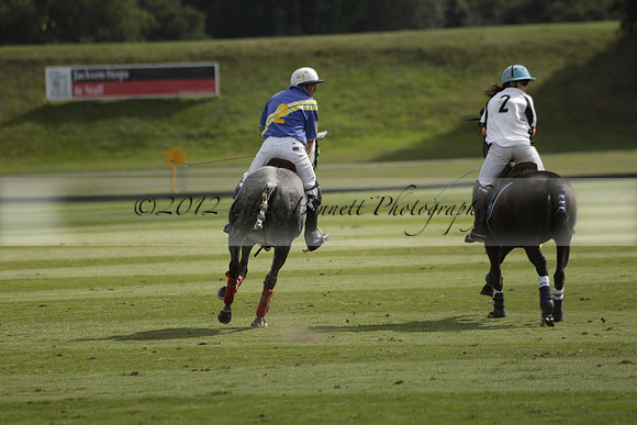 Combe Place (blue) v Silver Fox (white) in a Park House West Sussex Cup Polo match on Ambersham 1 at Cowdray Park Polo Club on Friday 30 August 2013. 2013.08.30 www.polopictures.co.uk