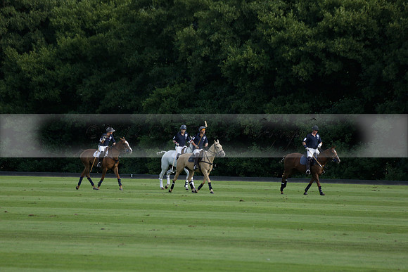 Pandas (white) v Home Farm (navy) in a Park House West Sussex Cup Polo match on Brooksfield at Cowdray Park Polo Club on Friday 30 August 2013. 2013.08.30 www.polopictures.co.uk