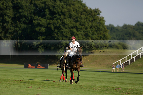 Pluma Negra (white) v Shoreline (black) in the Brecknock Cup Subsidiary final polo match played on Sunday 25 August 2013 at Cowdray Park Polo Club on Ambersham 1. 2013.10.12 www.polopictures.co.uk