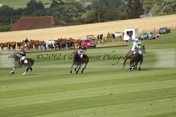Jaeger Le Coultre (black)  v Wairakei Pastoral (white) in a Jaeger Le Coultre Holden White Cup polo match played on 29 July 2013 at Cowdray Park Polo Club on Brooksfieldwww.polopictures.co.uk